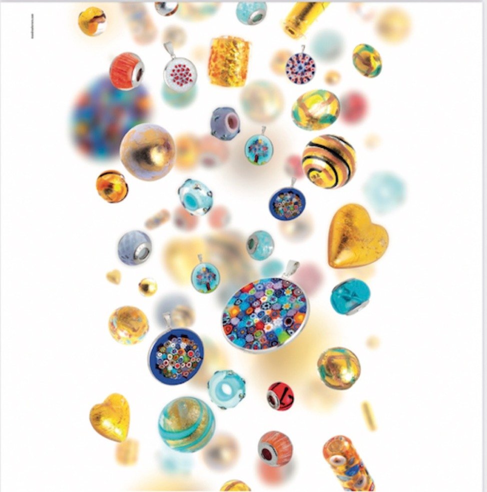 A spread of Murano glass beads, pendants and charms in many colours