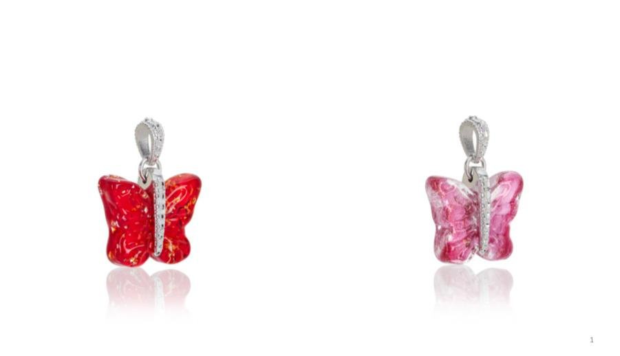 Two butterfly-shaped glass charms in red and pink