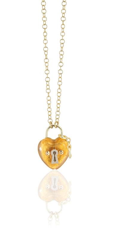 Heart-shaped gold leaf glass pendant with a keyhole detail